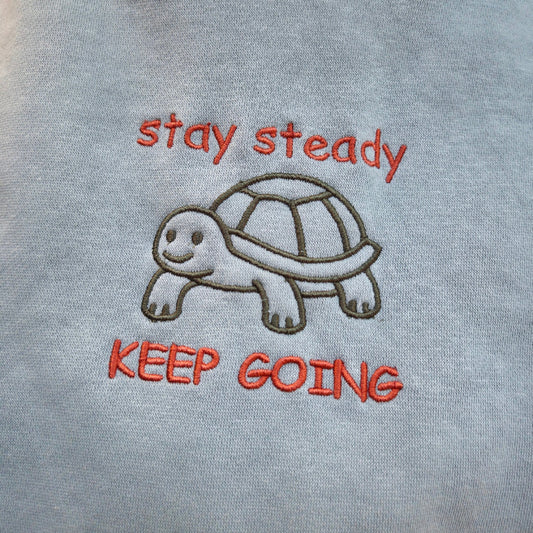 Close up embroidery of Stay Steady - Keep Going